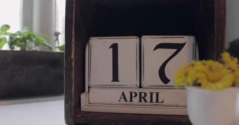 17 april calendar on top of a kitchen table with coltsfoot Stock Footage 176843837