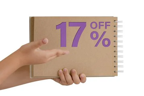 17 percent discount on isolate. Notepad from recycled paper in the hands of a Stock Photos