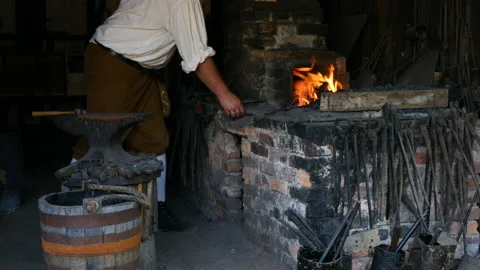 1700s Blacksmith stoking fire WS Stock Footage 168086944