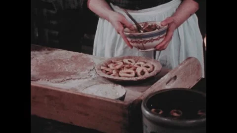 1700s Recreation: Fried rings of bread in bowl, person drizzles brown sugar 스톡 동영상 273521178