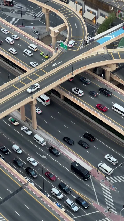 17.05.2025, Dubai, UAE: Multi-level highway with cars driving Stock Footage 338320198