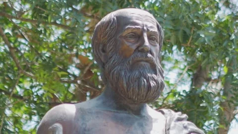 17/10/2024. A statue of Hippocrates surrounded by trees in slow motion 60fps 스톡 동영상 290094484