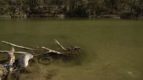 1715. Garbage in the River 4K Stock Footage 88736997