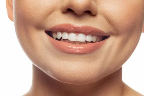 Cropped image of beautiful female lips, teeth, neck and chin isolated over white studio background. Dental care, perfect smile. Concept of female beauty, tenderness, cosmetology. Copy space for ad xkwx {woman,person,girl,face,age,teeth,dentist,natural,perfect,portrait,pretty,rejuvenation,sensual,sensuality,shoulder,skin,skin care,smile,smiling,tender,tenderness,treatment,wellness,white,model,lift,lifestyle,highlights,beautiful,beauty,body,care,clean,clear,close-up,contouring,copyspace,cosmetic,cropped,fragile,fresh,freshness,glow,happy,health,healthy,young,youth}