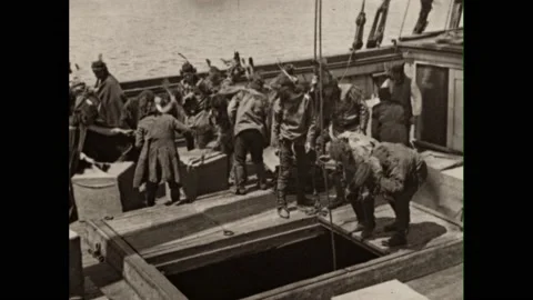 1760s: Men throwing crates from ship. Men smashing crates on ship. Intertitle. Видео 225711559