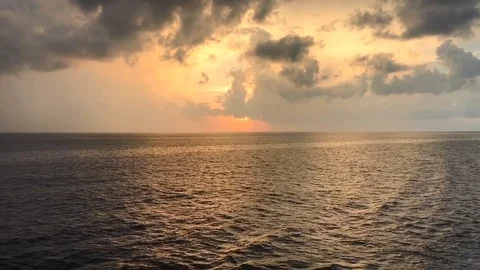18 second video ocean horizon pan from golden sunset to blue evening sky Stock Footage 96518562