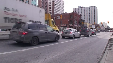 18 wheelers driving through a down town main street. #08-26 Stock-Footage 35629959