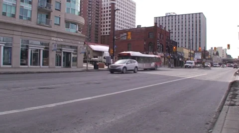 18 wheelers driving through a down town main street. #07-26 Stock Footage 35630029