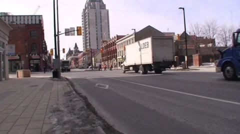 18 wheelers driving through a down town main street. #14-26 Stock Footage 35630283