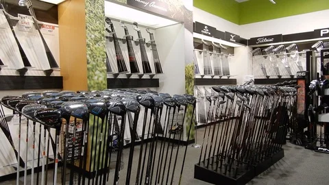 180 Degree Reverse Pan Of Golf Clubs For Sale In Golf Store Titleist Ping Stock-Footage 128642820