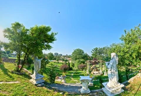 180 degrees panorama view of a rustic courtyard with statue replicas in Stock Photos