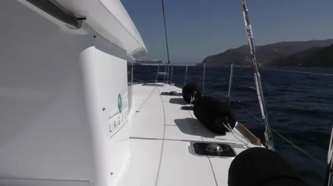 180 pan behind fast moving sailboat in heavy seas Video stock 68002223