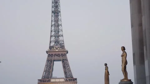 18.03.25 Eiffel tower rising above palais de chaillot statues Stock Footage 307908615