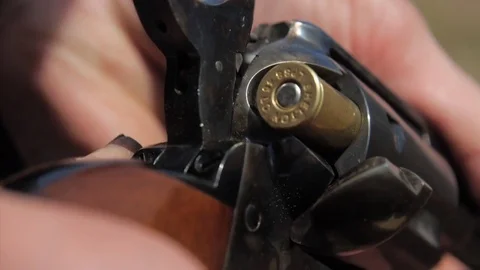 1870s Cavalry Colt Single-Action Revolver in detail - Brass Cartridges Stock Footage 81225784