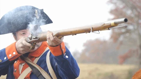 18th century Continental Soldier fires Brown Bess Flintlock Musket, black powder Stock Footage