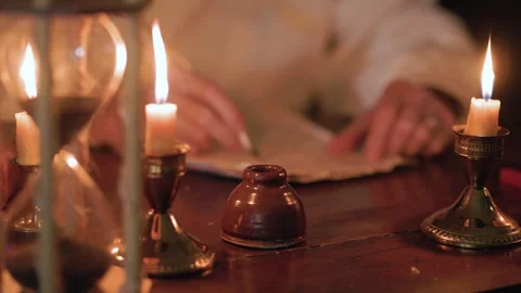 18th century man working at his desk using a quill pen Stock Footage 305075337