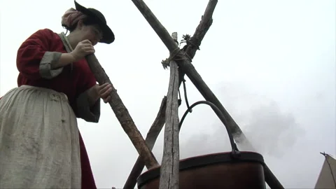 18th Century Re-enactment Boiling Cooking Pot with campfires Stock Footage 170899469
