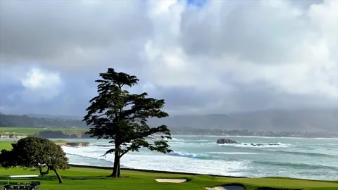 18th hole at Pebble Beach Golf Course - dramatic seascape and cloudscape Vídeos de archivo 276162994