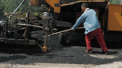 19 August 2018. Suzhou, China. Pavement machine laying fresh asphalt during Stock Footage 251803997
