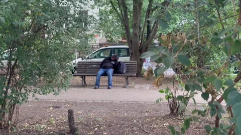 19, July, 2026, Berlin Germany: Homeless Man Sleeping In Park Stock Footage 340105743