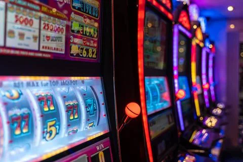  19 September 2023: Glowing slot machines in a casino. Gambling *** Leucht... Stock Photos