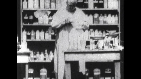 1900s: Edison Performs Experiments in front of Camera as he Prepares Kinetoscope Stock Footage 74937976
