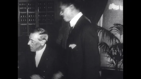 1900s: Shot of men in office/ Crowd watching train pull away/ People waving from Stock Footage 74771902