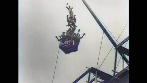 1902: Construction Workers Ride a Crane (Part 1) | 60fps, Colorized Stock Footage 239730957