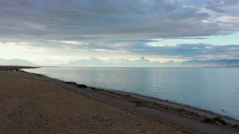 190Dramatic drone view of adventurer driving on the shore of Lake Viedma Stock Footage 255838944