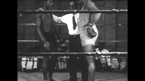 1910s -- Boxer, Jack Johnson, boxes in a ring, and talks to a camera in a car Stock-Footage 115550638