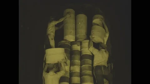 1910s: Men climbing ladders to stack pot... | Stock Video | Pond5