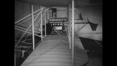 1910s: side profile of man sat in basic plane. Man pulls levers on plane. Wing Video stock 75151929