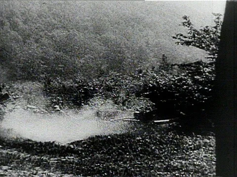 1910s: WORLD WAR ONE REENACTMENT? :land battle explosions, soldiers run & drop Stock Footage
