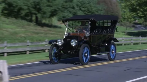 1912 Cadillac being driven down the road Stock Footage 67212844