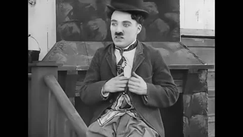 1914 - In this silent comedy, an amorous man on a film set jumps into a scene Stock Footage 238772972