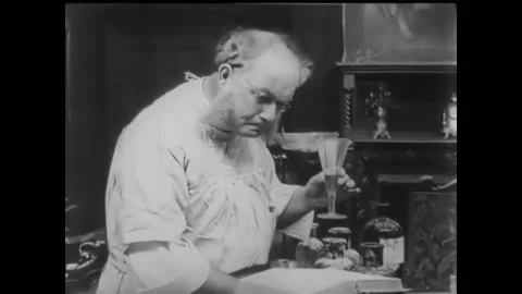 1914 - In this silent comedy, a scientist works on discovering the elixir of Stock Footage 246360762