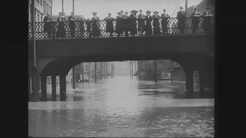 1915, 1916 - Boats float through Ohio streets during the flood, dogs, stand on a Stock Footage 84892182