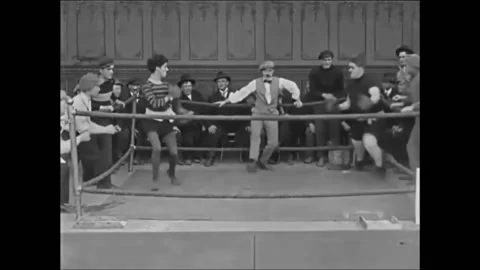 1915 - In this silent comedy, a stumbling man (Charlie Chaplin) manages to stay Stock Footage 238772895
