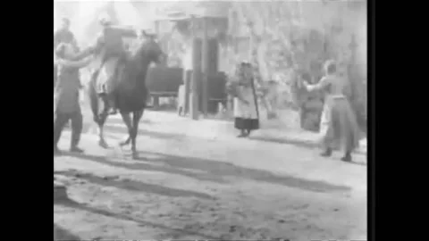 1916 - In this dramatic war b-movie, people rush to meet a line of soldiers 스톡 동영상 217371071