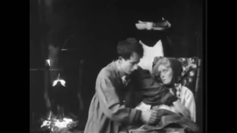 1916 - In this dramatic war b-movie, a man takes care of a sick and dying woman. 動画素材 217371253