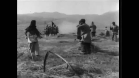 1916 - In this dramatic war b-movie, soldiers take men working in the fields at Stock Footage 217371357