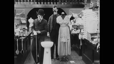 1916 - In this silent comedy, an employee uses the water fountain and products Stock Footage 234546157