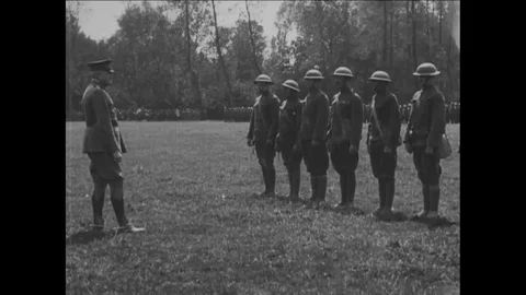 1918 - 1st Division Troops are decorated by General John Pershing on a field in Stock Footage 83459480