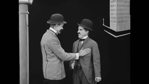 1918 - In this silent comedy, a pushy salesman won't let go of a polite Stock Footage 241809979
