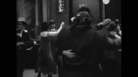 1918 - In this silent comedy, a tall, big woman who is dancing with a short man Stock Footage 229352897