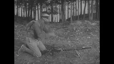 1918 - A soldier demonstrates loading a machine gun blindfolded, and soldiers Stock Footage 83106735
