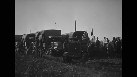 1919 - A tractor is used to pull a US Army truck out of the mud. Stock Footage 238675065