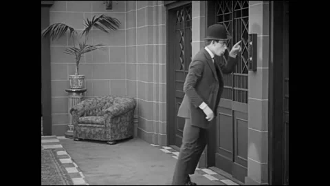 1920 - In this silent comedy, a man (Harold Lloyd) steals decorative pieces from Stock Footage 168968867