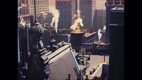 1920 - Steam issues from the rooftops of myriad buildings across New York City. Stock Footage 241799052