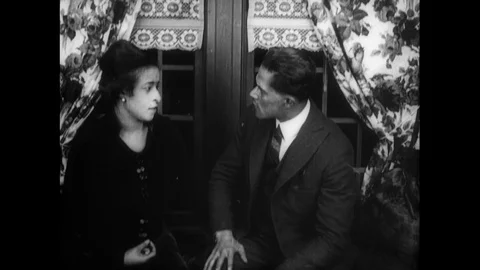 1920 - While molesting a young African-American woman, a white man sees her scar Stock Footage 129059141
